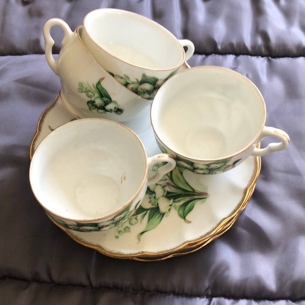 Four vintage floral tea cup and saucers